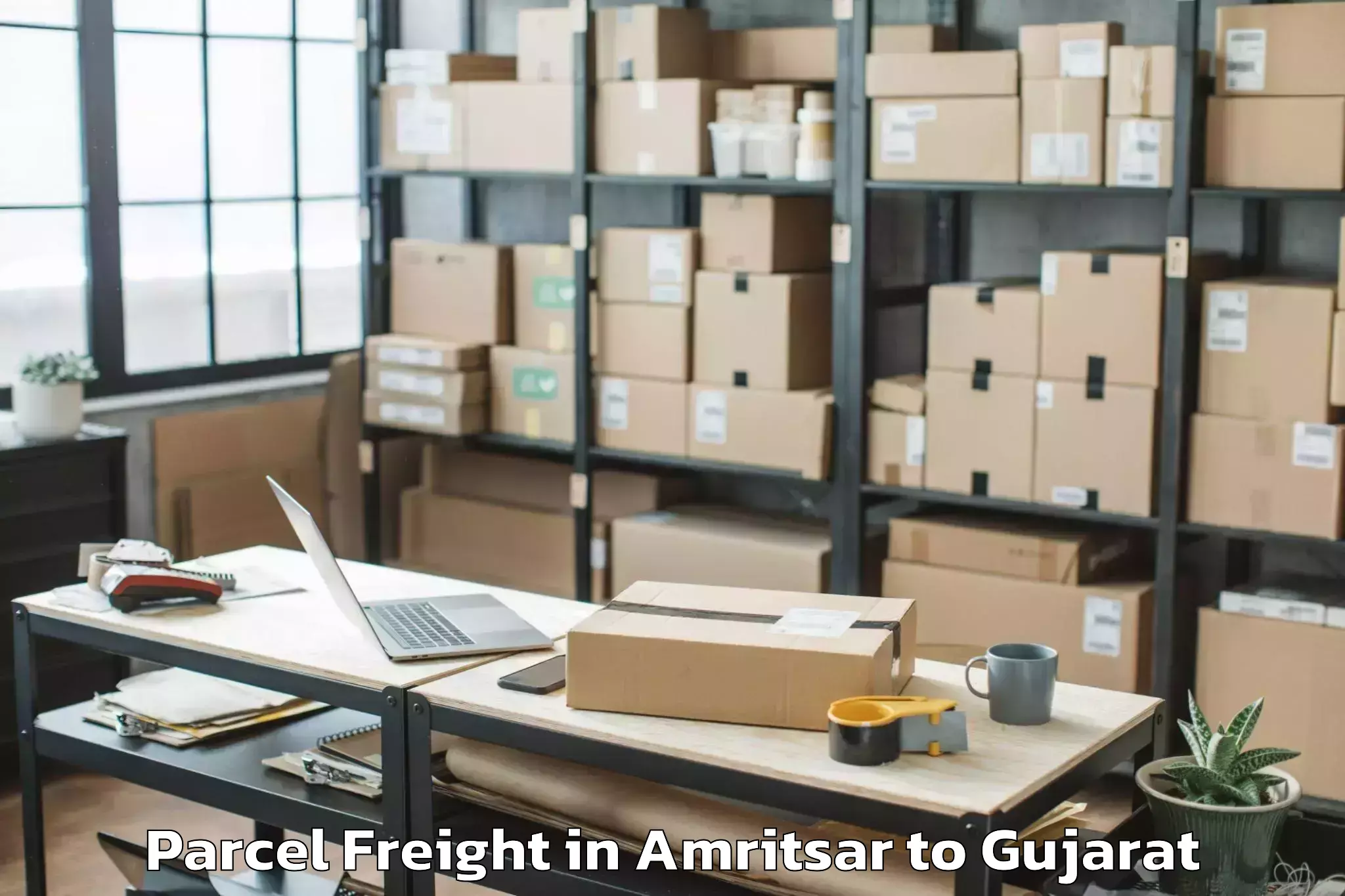 Book Amritsar to Sardarkrushinagar Dantiwada Ag Parcel Freight